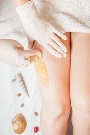 Epilation of thighs with wax